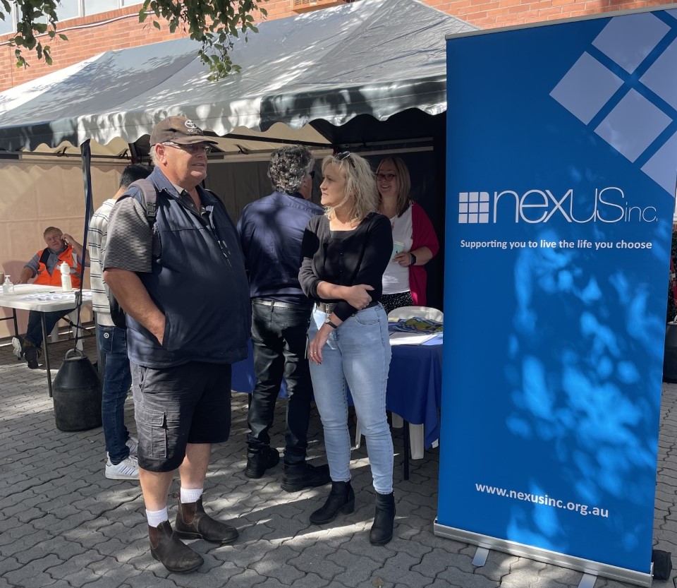 Nexus staff speak with enthusiastic job-seekers at their stall at the Glenorchy Jobs Fair this week. 